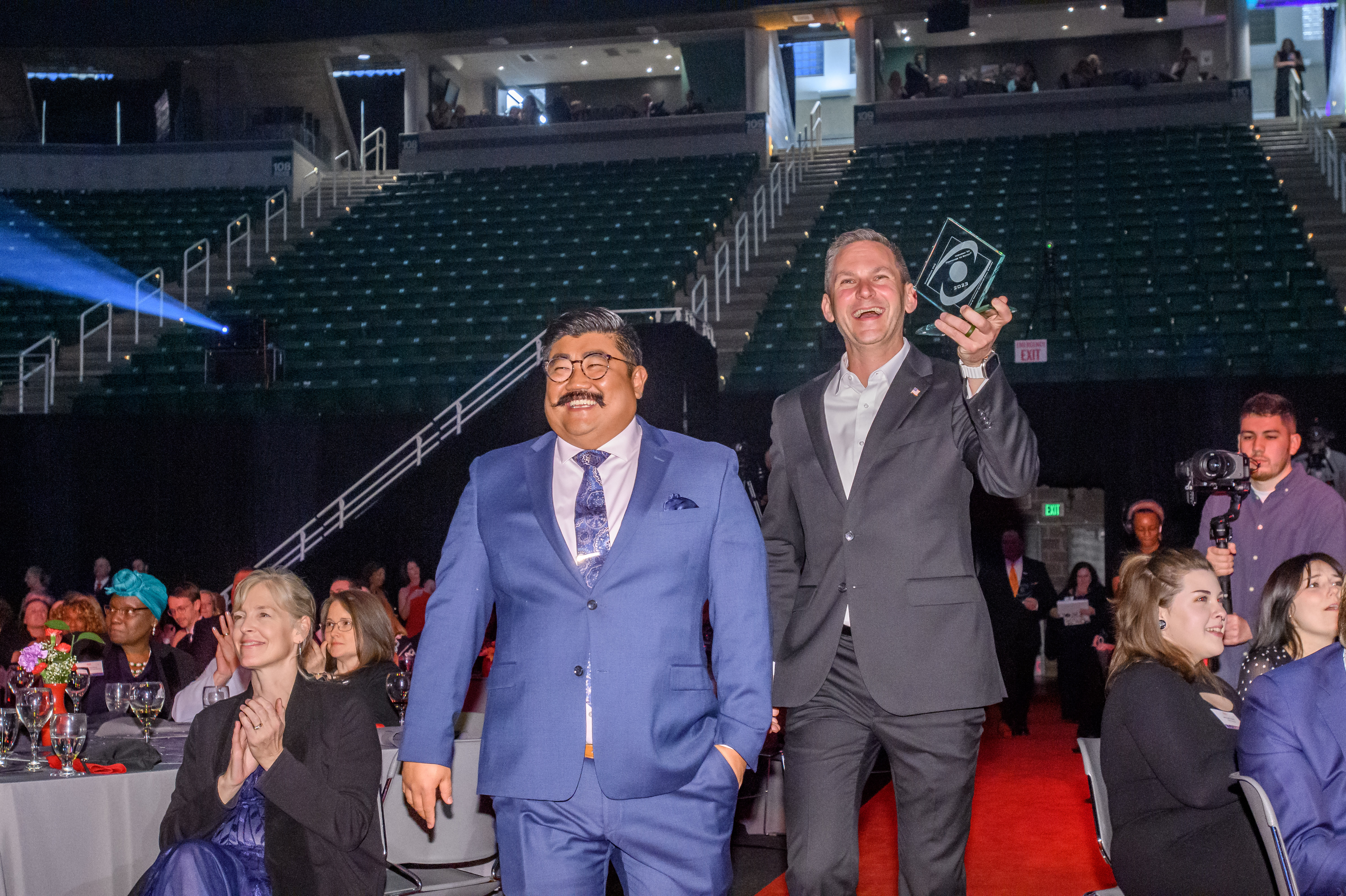 Travis Stoliker walking the red carpet with BOTY award at MSU Breslin Center
